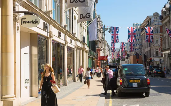 A London shopping street decorated with Union flags